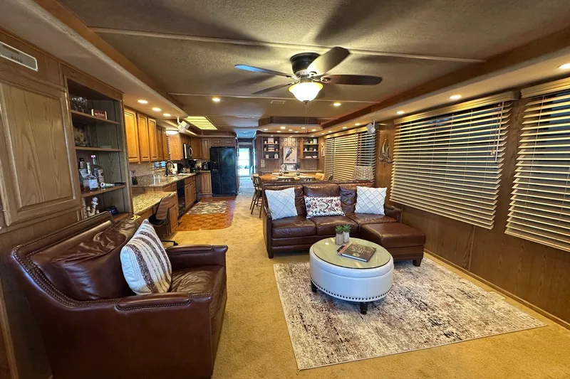 Slide: The Image of Luxurious interior of a 1999 Sumerset 16x75 houseboat with leather seating and modern kitchen. - 2