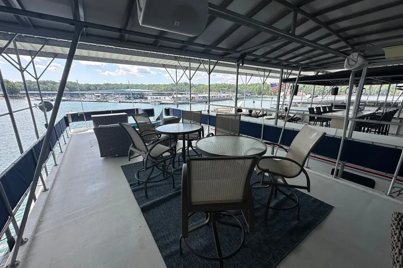 Slide: The Image of Outdoor seating area on a 1999 Sumerset 16x75 houseboat with lake view. - 15