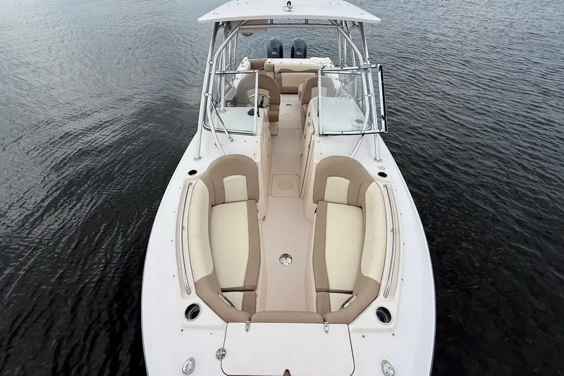 Slide: The Image of 2013 Grady-White Freedom 275 boat with spacious seating on calm water. - 31