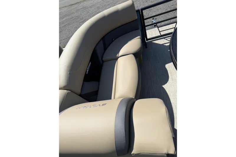 Slide: The Image of Beige seating on 2026 Sylvan X-3 CLZ DH boat, outdoor setting. - 14