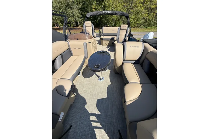 Slide: The Image of Interior of 2026 Sylvan X-3 CLZ DH pontoon boat with beige seating and table. - 17