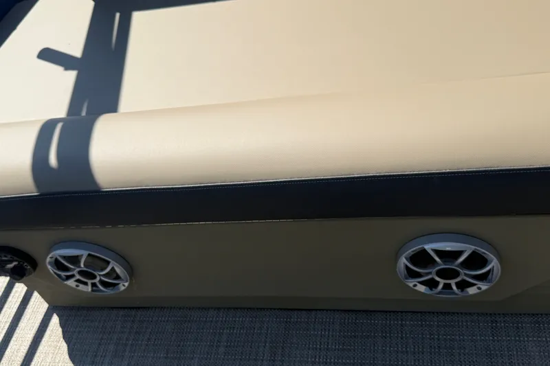 Slide: The Image of Beige and black seating with speakers on a 2026 Sylvan X-3 CLZ DH boat. - 22