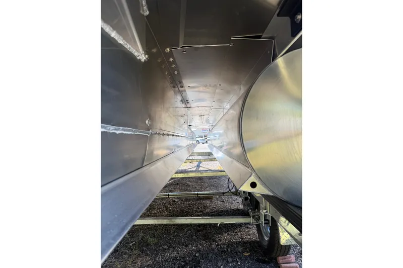 Slide: The Image of Underneath view of 2026 Sylvan X-3 CLZ DH boat, showcasing sleek aluminum construction. - 30