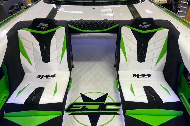 Slide: The Image of 2022 Daves Custom Boats DCB M-44 interior with green and white seating design. - 17