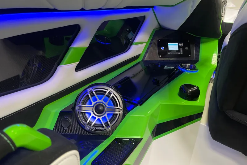Slide: The Image of Interior of 2022 Daves Custom Boats DCB M-44 with vibrant green accents and audio system. - 29