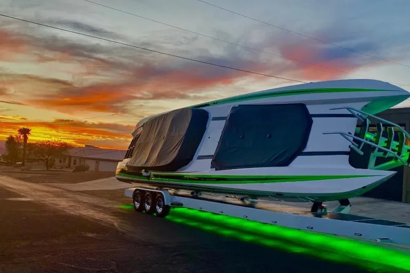 Slide: The Image of 2022 Daves Custom Boats DCB M-44 with green underglow at sunset. - 7