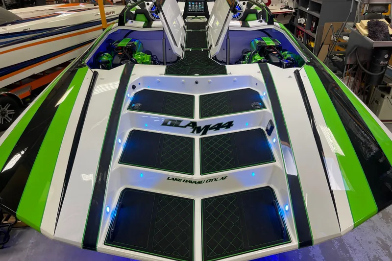 Slide: The Image of 2022 Daves Custom Boats DCB M-44 with vibrant green and black detailing. - 36