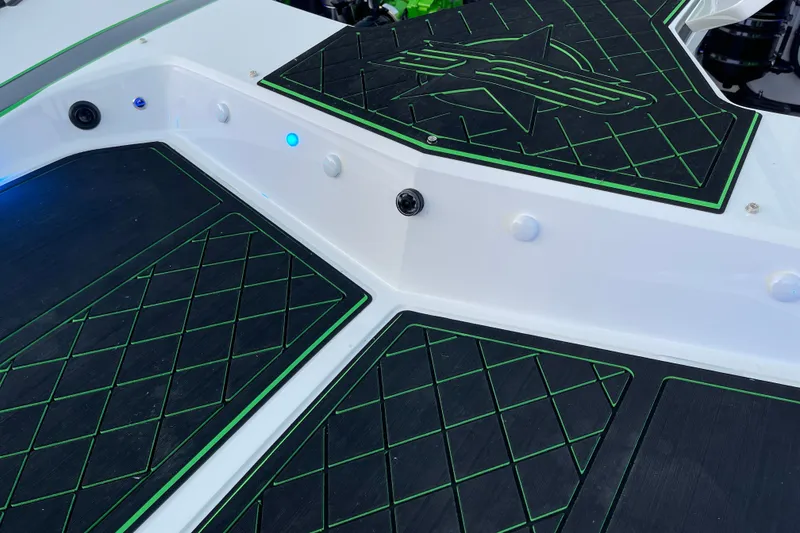 Slide: The Image of 2022 Daves Custom Boats DCB M-44 deck with black and green diamond pattern mats. - 37