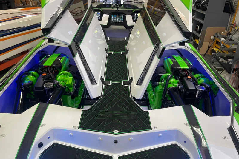 Slide: The Image of 2022 Daves Custom Boats DCB M-44 with open engine compartments, showcasing vibrant green engines. - 31