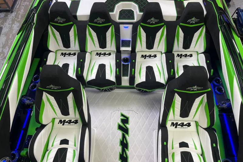 Slide: The Image of 2022 Daves Custom Boats DCB M-44 interior with green and white seating design. - 25