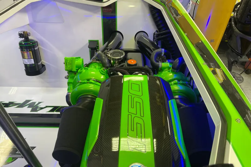 Slide: The Image of Engine compartment of 2022 Daves Custom Boats DCB M-44, featuring vibrant green components. - 33