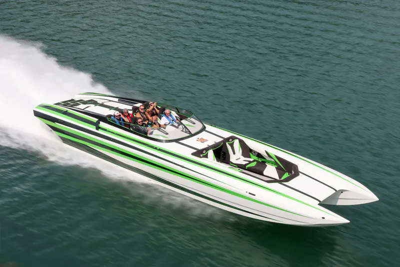 Slide: The Image of 2022 Daves Custom Boats M-44 speeding on water, featuring sleek design and vibrant colors. - 43