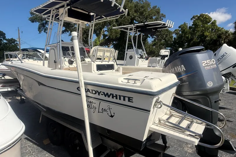 Slide: The Image of 2002 Grady-White Fisherman 222 boat with Yamaha 250 engine, parked outdoors. - 2