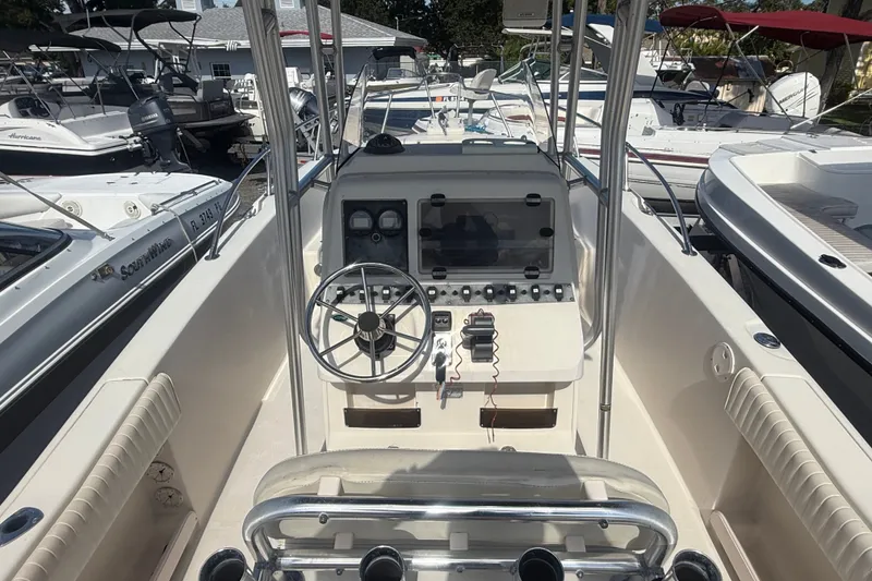 Slide: The Image of 2002 Grady-White Fisherman 222 boat cockpit with steering wheel and control panel. - 26