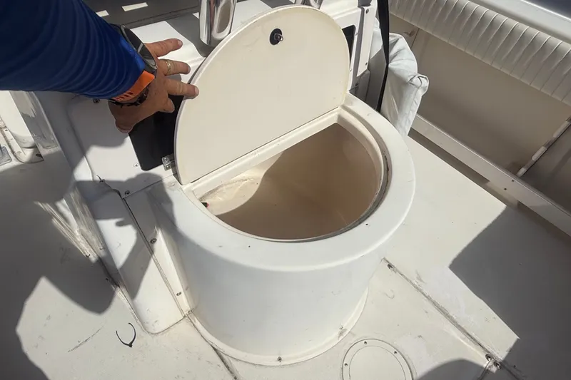 Slide: The Image of Open storage compartment on 2002 Grady-White Fisherman 222 boat deck. - 24