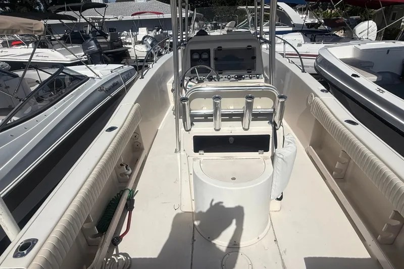 Slide: The Image of 2002 Grady-White Fisherman 222 boat interior with console and rod holders. - 13