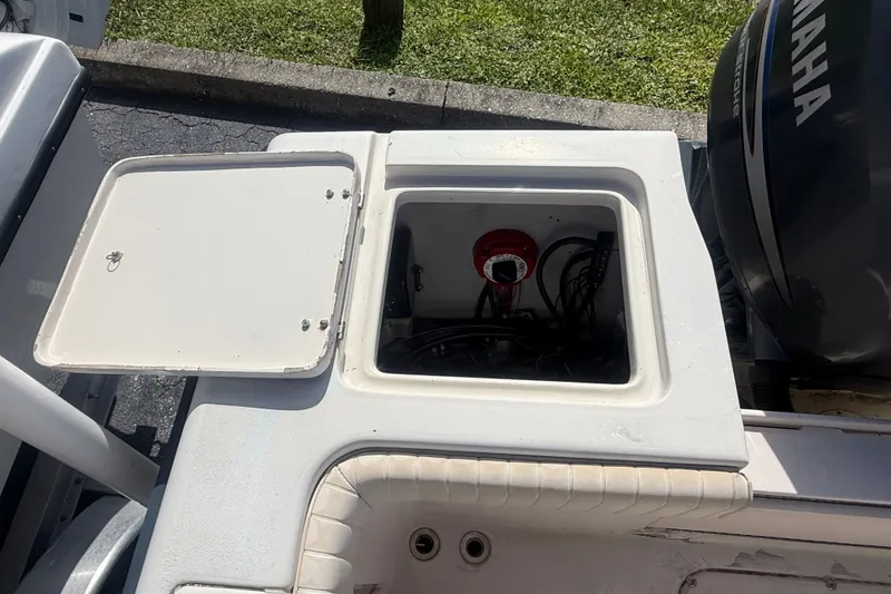 Slide: The Image of Open storage compartment on a 2002 Grady-White Fisherman 222 boat, showing internal wiring. - 16