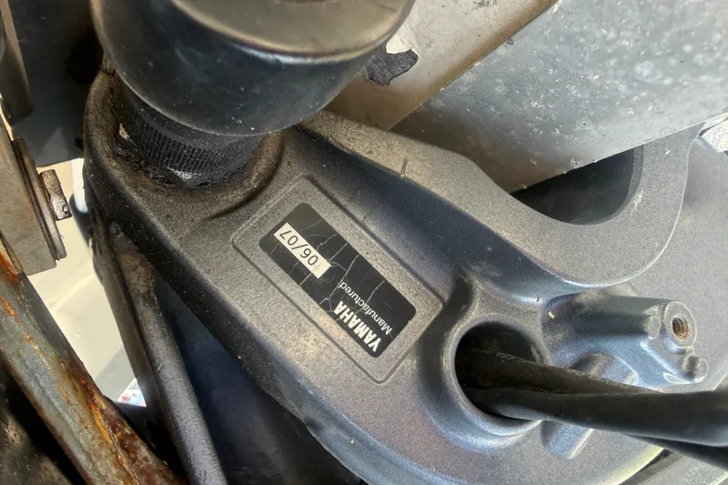 Slide: The Image of Close-up of a Yamaha engine part on a 2002 Grady-White Fisherman 222 boat. - 40