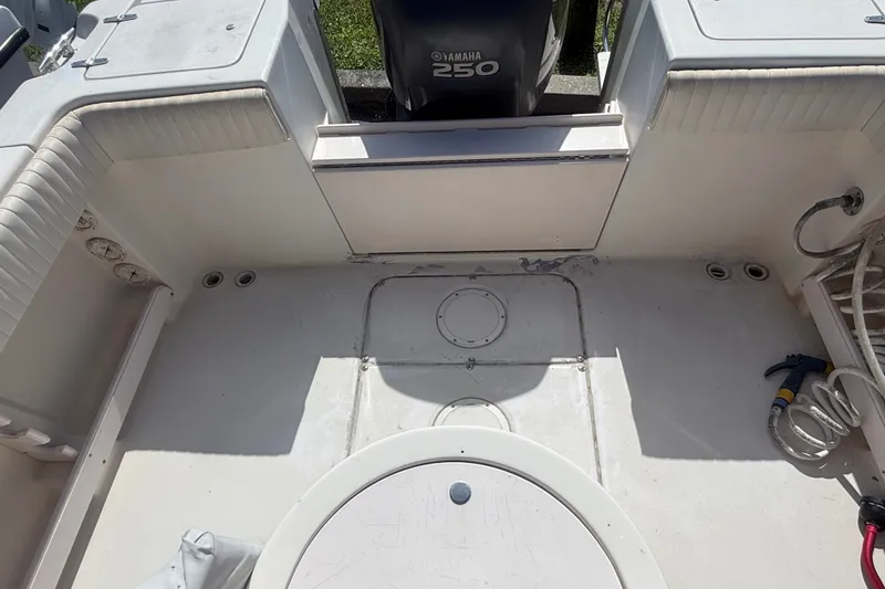 Slide: The Image of 2002 Grady-White Fisherman 222 boat deck with Yamaha 250 engine. - 19