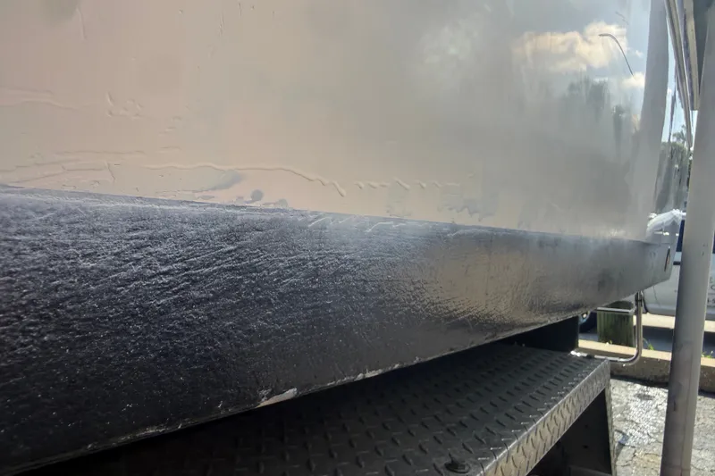 Slide: The Image of Close-up of 2002 Grady-White Fisherman 222 boat hull on a trailer. - 12