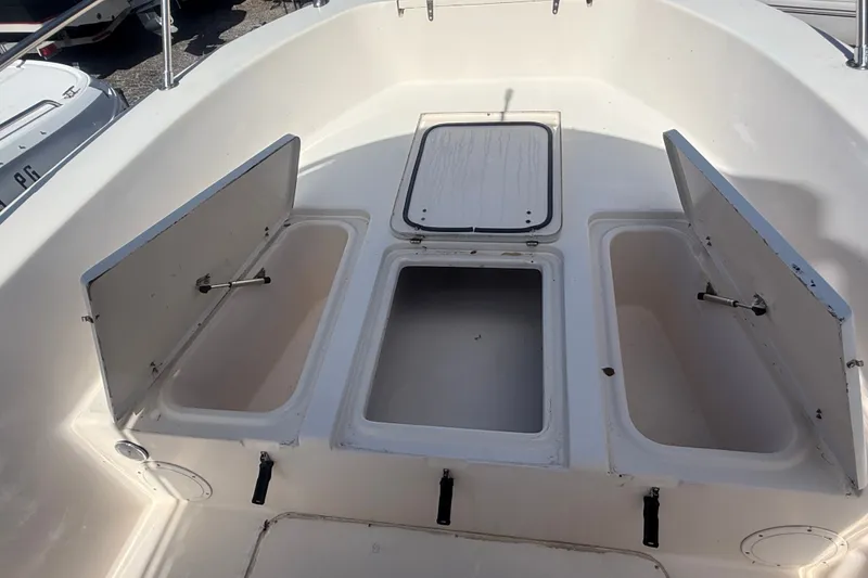 Slide: The Image of Open storage compartments on a 2002 Grady-White Fisherman 222 boat deck. - 31