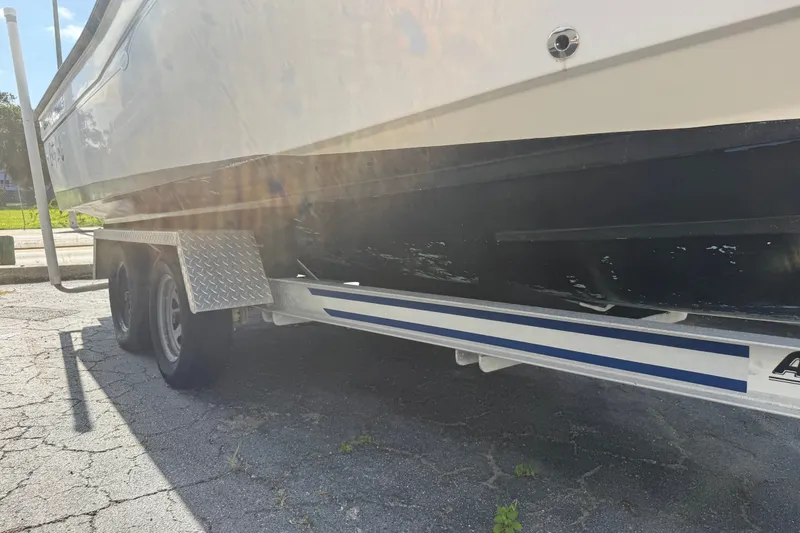 Slide: The Image of 2002 Grady-White Fisherman 222 boat on trailer, side view, sunny day. - 37