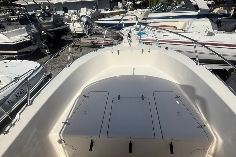 Slide: The Image of 2002 Grady-White Fisherman 222 boat deck, surrounded by other boats in a marina. - 30