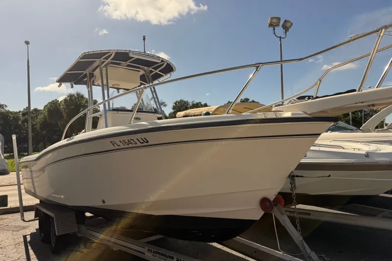 Slide: The Image of 2002 Grady-White Fisherman 222 boat on trailer under clear sky. - 1