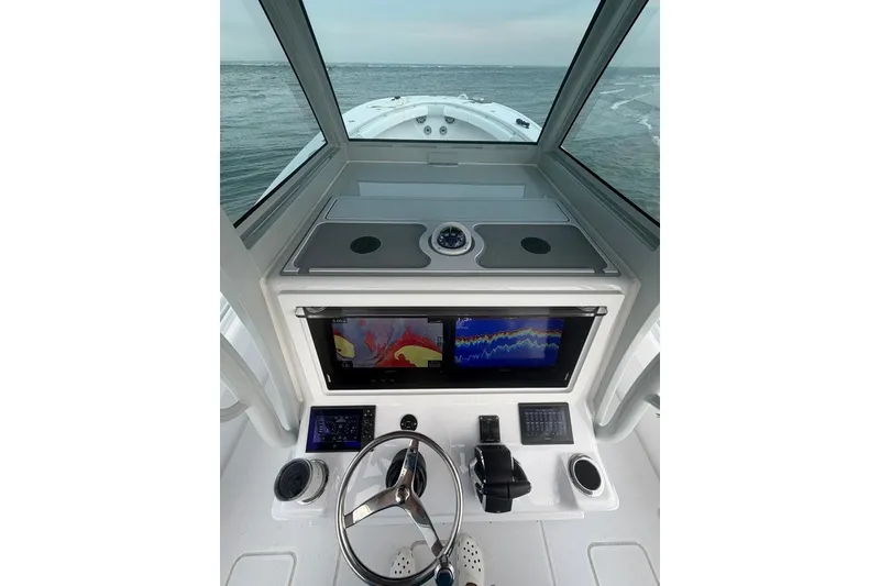 Slide: The Image of Helm of 2026 Onslow Bay 37 Tournament Edition boat with advanced navigation displays. - 58