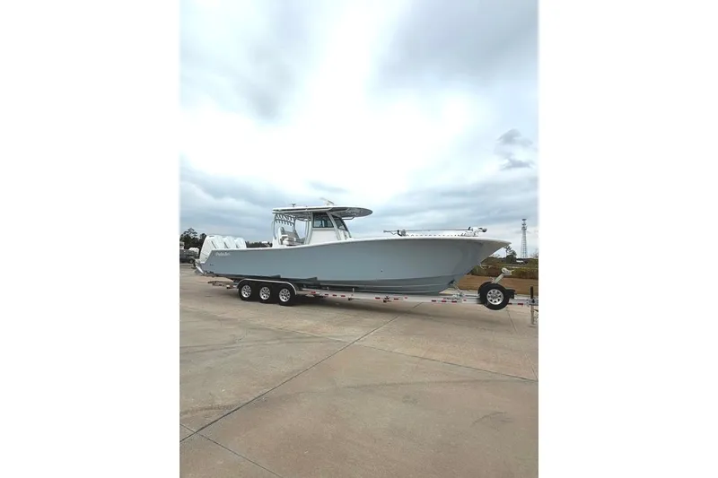 Slide: The Image of 2026 Onslow Bay 37 Tournament Edition boat on trailer, parked outdoors. - 102