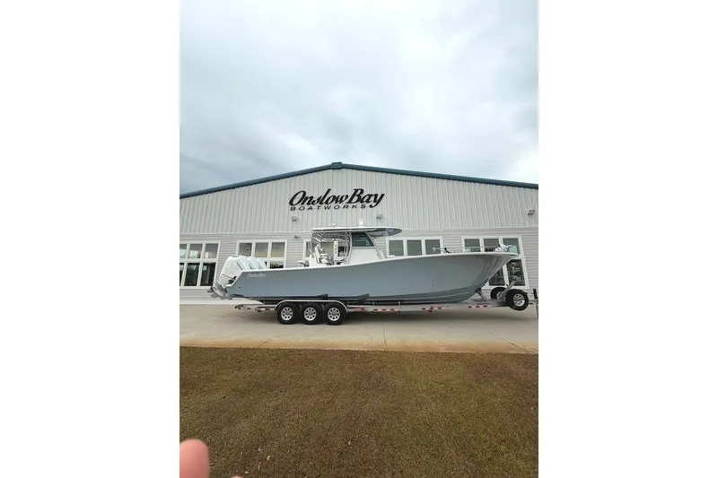 Slide: The Image of 2026 Onslow Bay 37 Tournament Edition boat outside Onslow Bay Boatworks building. - 108