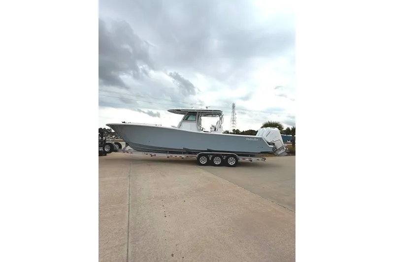 Slide: The Image of 2026 Onslow Bay 37 Tournament Edition boat on trailer under cloudy sky. - 105