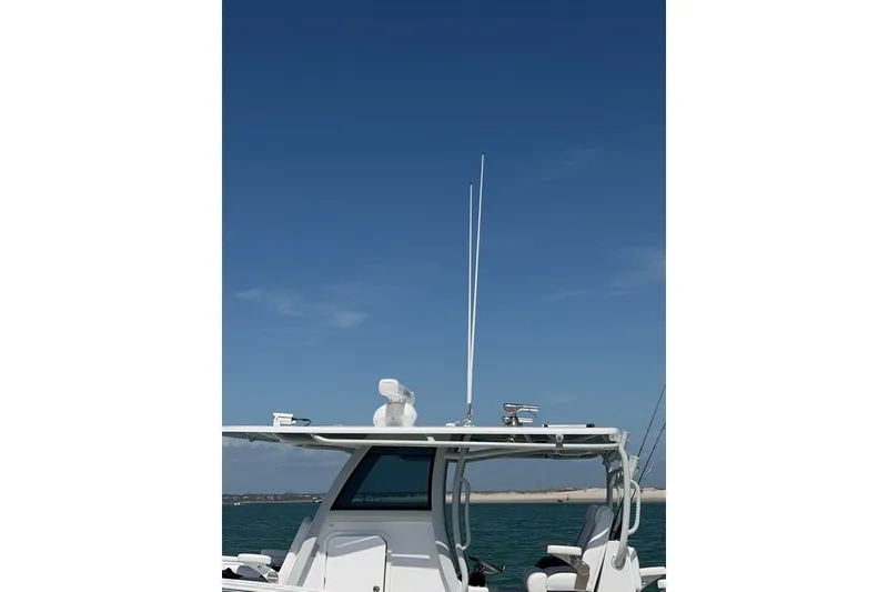 Slide: The Image of 2026 Onslow Bay 37 Tournament Edition boat with antennas against a clear blue sky. - 39