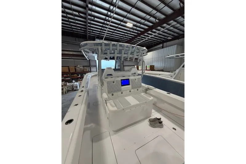 Slide: The Image of 2026 Onslow Bay 37 Tournament Edition boat interior in a warehouse setting. - 90