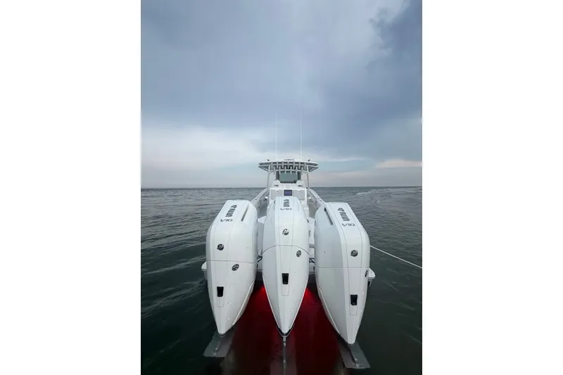 Slide: The Image of 2026 Onslow Bay 37 Tournament Edition boat with triple engines on calm water. - 45