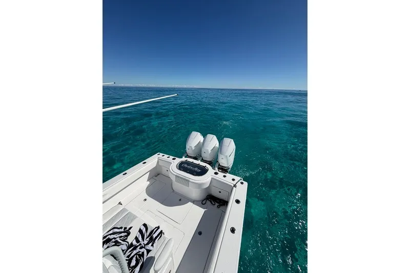 Slide: The Image of 2026 Onslow Bay 37 Tournament Edition boat on clear blue ocean waters. - 124