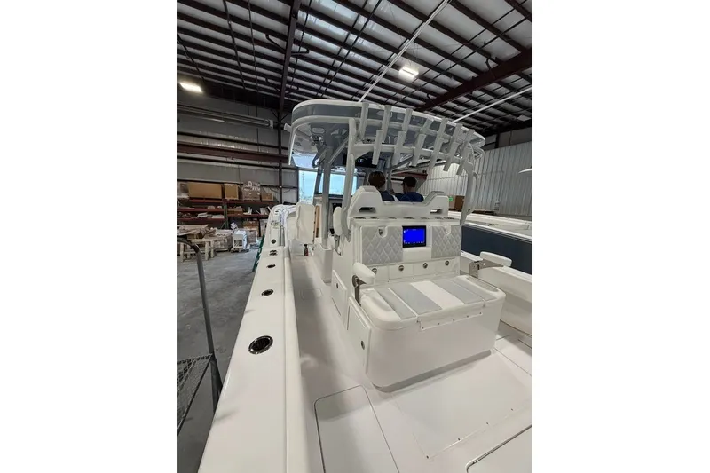 Slide: The Image of 2026 Onslow Bay 37 Tournament Edition boat interior in a warehouse setting. - 82