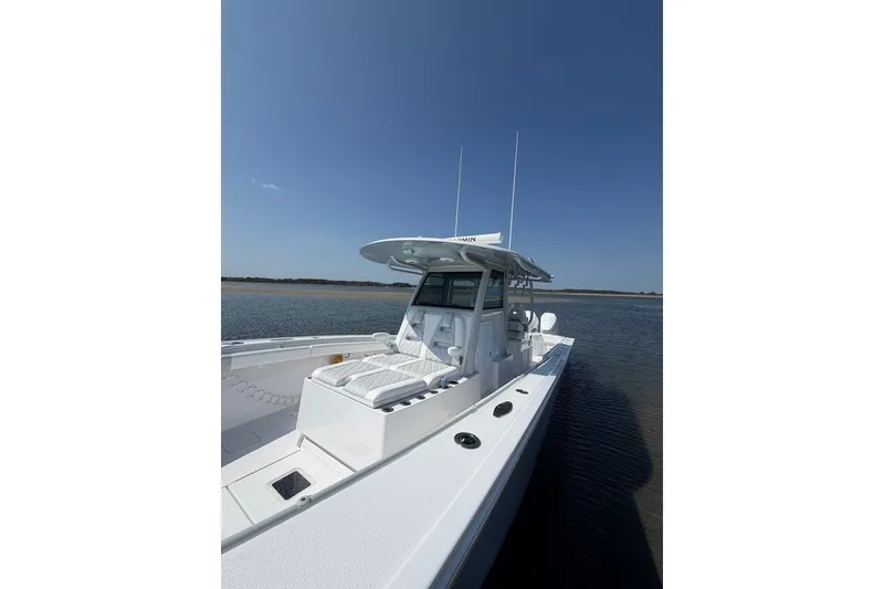 Slide: The Image of 2026 Onslow Bay 37 Tournament Edition boat on calm water under clear blue sky. - 30