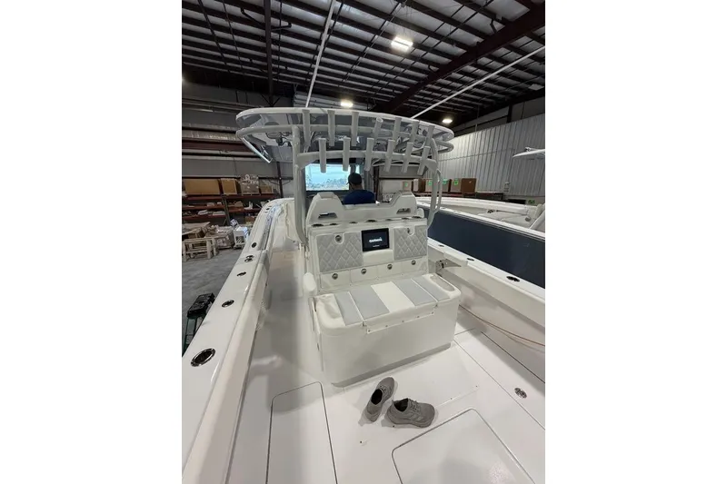 Slide: The Image of 2026 Onslow Bay 37 Tournament Edition boat interior in a warehouse setting. - 72