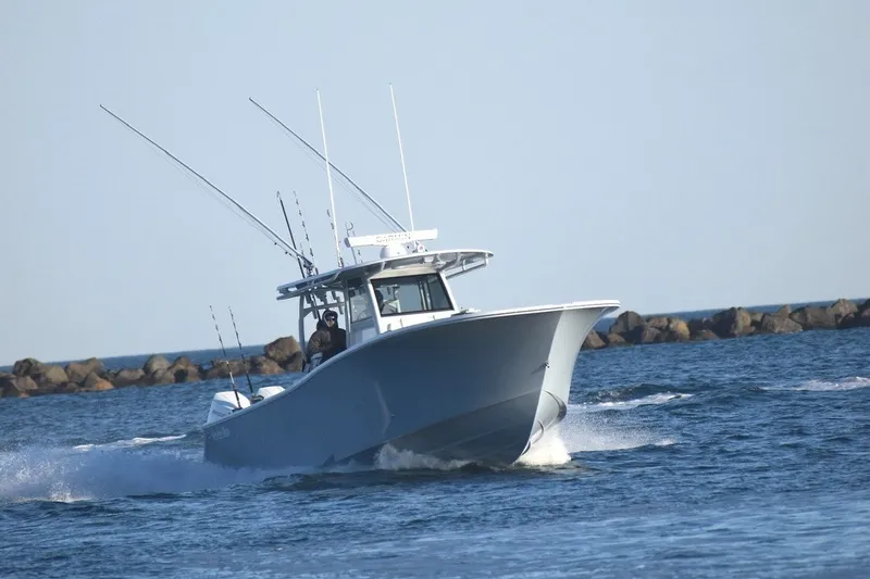 Slide: The Image of 2026 Onslow Bay 37 Tournament Edition boat cruising on open water. - 21
