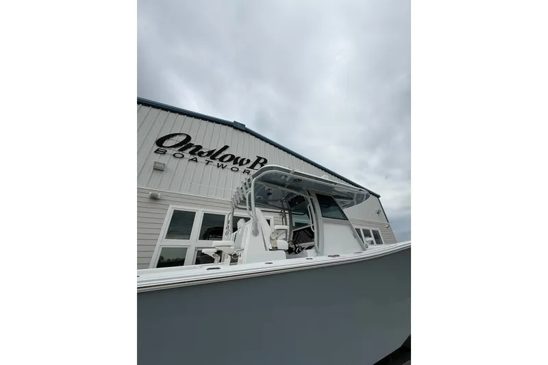 Slide: The Image of Onslow Bay 37 Tournament Edition boat, 2026 model, outside Onslow Bay Boatworks building. - 112