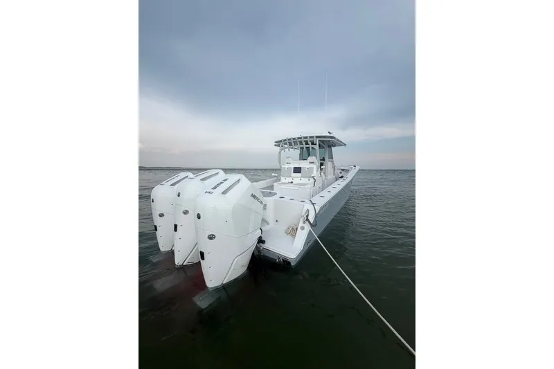 Slide: The Image of 2026 Onslow Bay 37 Tournament Edition boat with triple Mercury engines on water. - 47