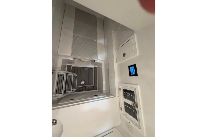 Slide: The Image of Interior view of 2026 Onslow Bay 37 Tournament Edition boat, featuring sleek control panels. - 85