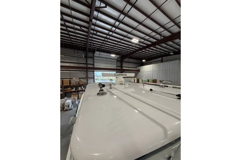 Slide: The Image of 2026 Onslow Bay 37 Tournament Edition boat in warehouse with Garmin equipment. - 83