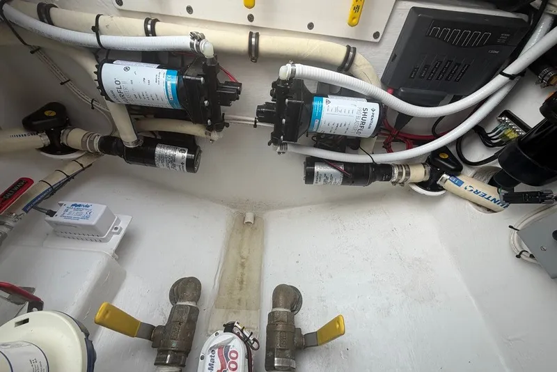 Slide: The Image of Engine compartment of 2026 Onslow Bay 37 Tournament Edition with plumbing and electrical components. - 71