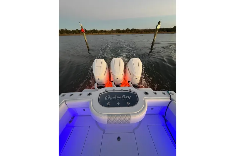 Slide: The Image of Onslow Bay 37 Tournament Edition 2026 boat with triple engines on water. - 120