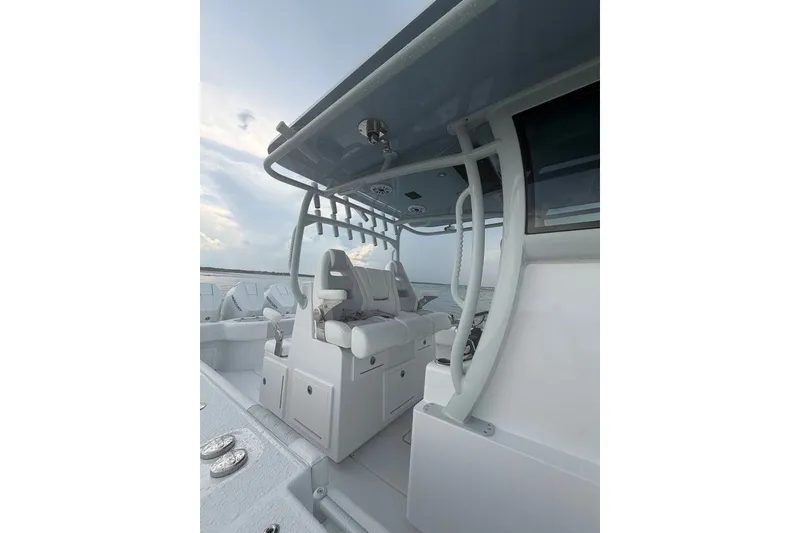 Slide: The Image of 2026 Onslow Bay 37 Tournament Edition boat interior with seating and rod holders. - 51
