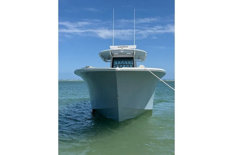 Slide: The Image of 2026 Onslow Bay 37 Tournament Edition boat anchored in clear blue water. - 42