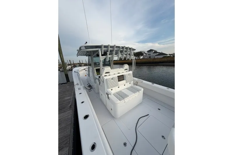 Slide: The Image of 2026 Onslow Bay 37 Tournament Edition boat docked by the water. - 115