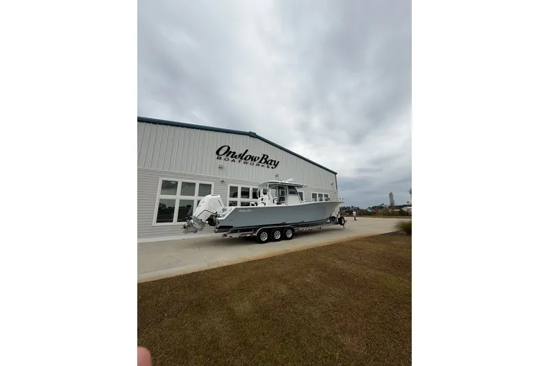 Slide: The Image of 2026 Onslow Bay 37 Tournament Edition boat outside Onslow Bay Boatworks building. - 109